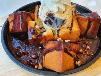 High angle view of ice cream and honey toast in plate on table