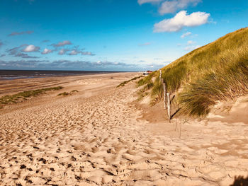 Scenic view of beach against sky