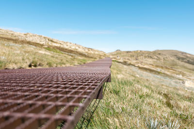 Sunset view of the rusty steel boardwalk between summit of mount kosciuszko and thredbo chairlift