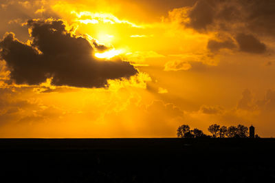 Scenic view of dramatic sky during sunset