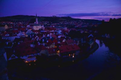 High angle view of illuminated buildings in city at night