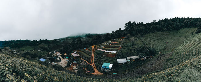 Panoramic view of building and mountains against sky