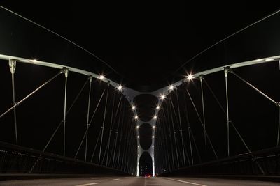 Illuminated suspension bridge at night