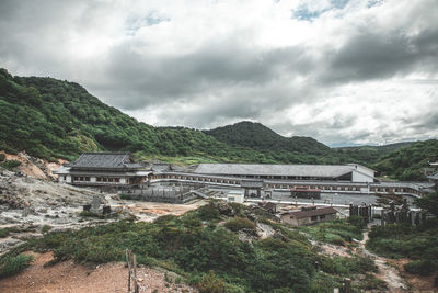 High angle view of townscape against cloudy sky