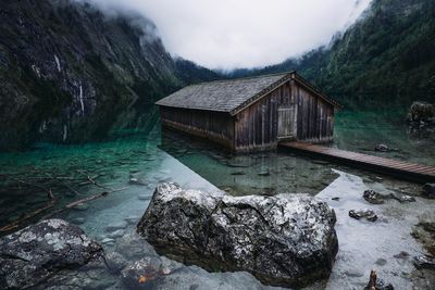 Scenic view of house in lake during winter