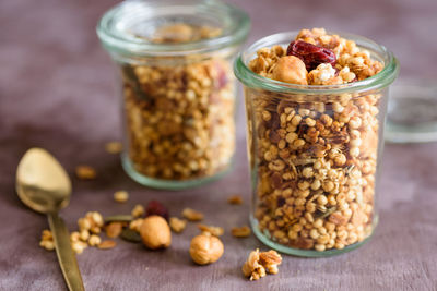 Close-up of cereals in jars on table
