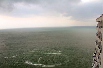 High angle view of sea against cloudy sky