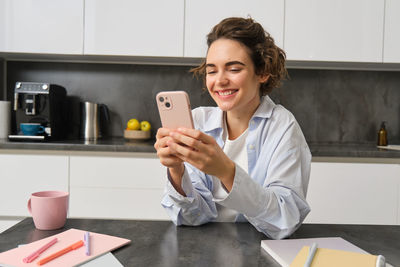 Young woman using mobile phone