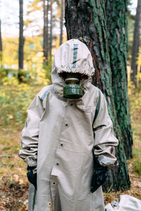 Rear view of man standing in forest