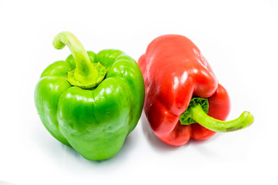 Close-up of bell peppers against white background