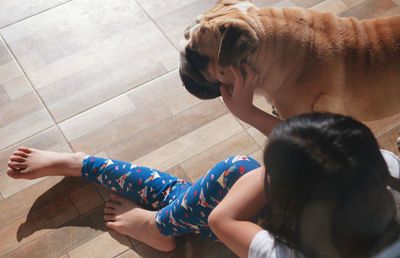 High angle view of mother and daughter on floor