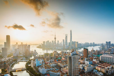 Cityscape against sky during sunset