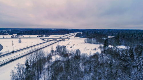 Panoramic view of city during winter against sky