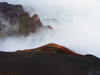 Scenic view of volcanic mountain against sky