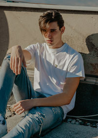 Portrait of young man sitting at home