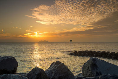 Scenic view of sea against sky during sunset