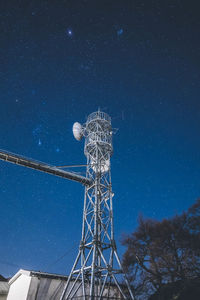 Low angle view of star field against blue sky at night