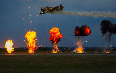 Firework display against sky