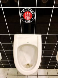 High angle view of information sign in bathroom