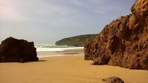 Scenic view of beach against sky