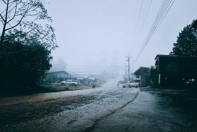 Wet street in city during winter