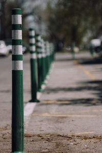 Close-up of wooden post on footpath