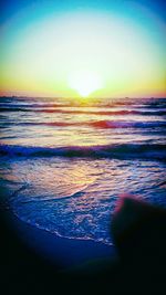 Scenic view of sea against clear sky during sunset