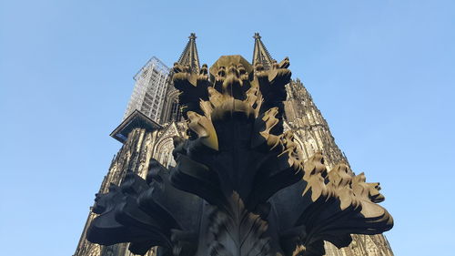 Low angle view of sculptures at cologne cathedral
