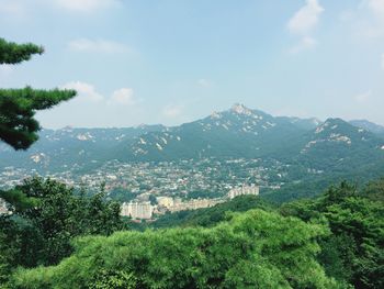 Cityscape with mountain range in background