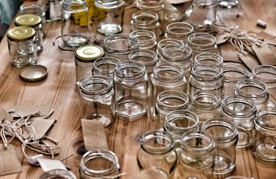 High angle view of empty glass jars on table