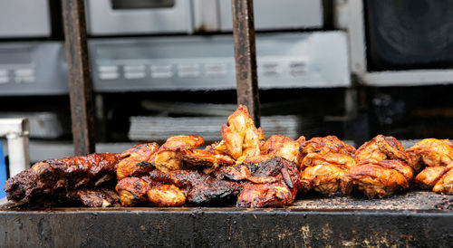 Barbecue ribs and chicken on the grill at a summer festival