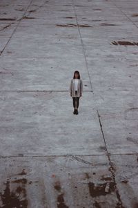 High angle view of woman standing on floor