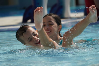 Boy swimming in pool