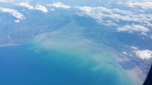 Aerial view of landscape against blue sky