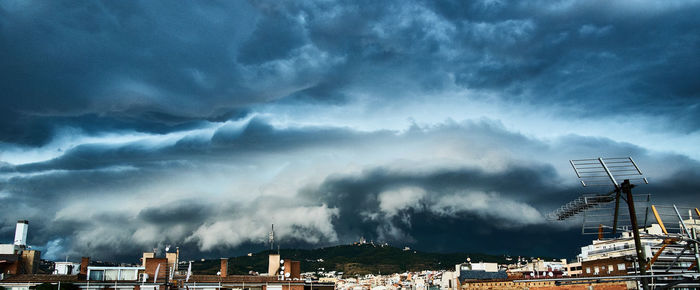 Panoramic view of storm clouds over city