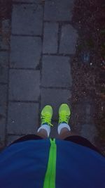 Low section of man standing on ground