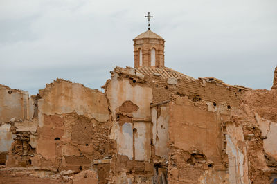 Low angle view of old building against sky