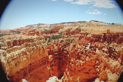 Scenic view of landscape against blue sky