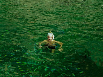 Portrait of woman swimming in sea