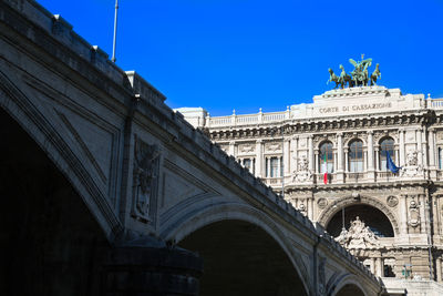 Low angle view of historical building against blue sky