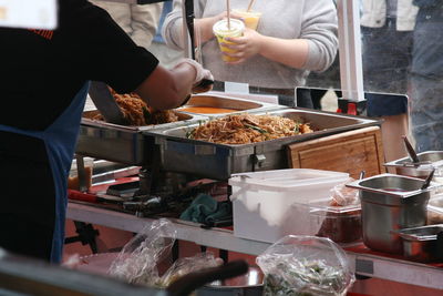 Midsection of man preparing food