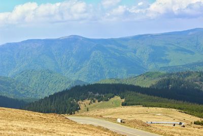 Scenic view of landscape and mountains against sky