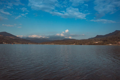 Scenic view of lake against blue sky