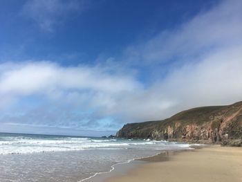 Scenic view of beach against sky