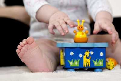 Close-up of baby playing with toy