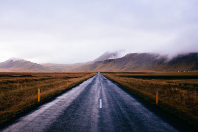 Road amidst landscape against sky