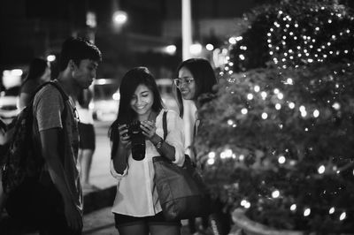 Portrait of young couple standing outdoors