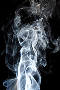 Close-up of smoke against black background