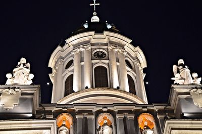 Low angle view of illuminated church against clear sky at night