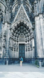 Low angle view of man standing in front of building
